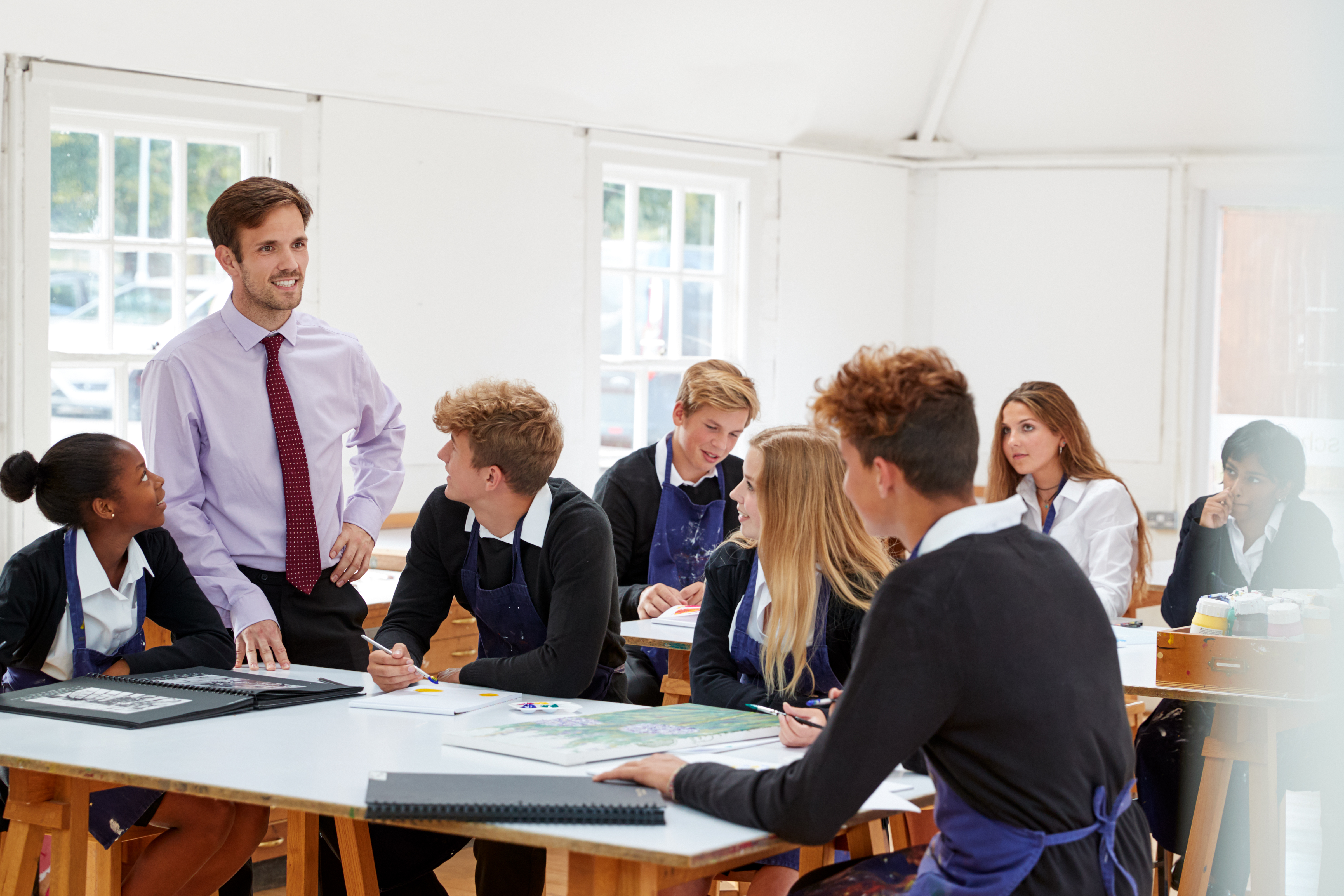 Teacher with a class of high school students